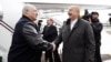Alyaksandr Lukashenka (left) is greeted by Ilham Aliyev at the Fuzuli airport on May 17.