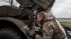 Військовослужбовець 59-ї окремої мотопіхотної бригади ЗСУ з позивним «Скорпіон» біля реактивної системи залпового вогню БМ-21 «Град». Поблизу лінії фронту на Донбасі, 4 лютого 2024 року