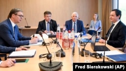 European Union foreign policy chief Josep Borrell (center, back) meets with Serbian President Aleksandar Vucic (left) and Kosovar Prime Minister Albin Kurti (right) during a meeting in Brussels on May 2.