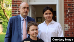 Jamie Fly, Kateryna Yesypenko, and Stefania Yesypenko at the Ukraine House in Washington, D.C. on May 18, 2023.