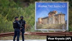 Kosovar police officers secure a road leading to the monastery in the village of Banjska on September 24. 