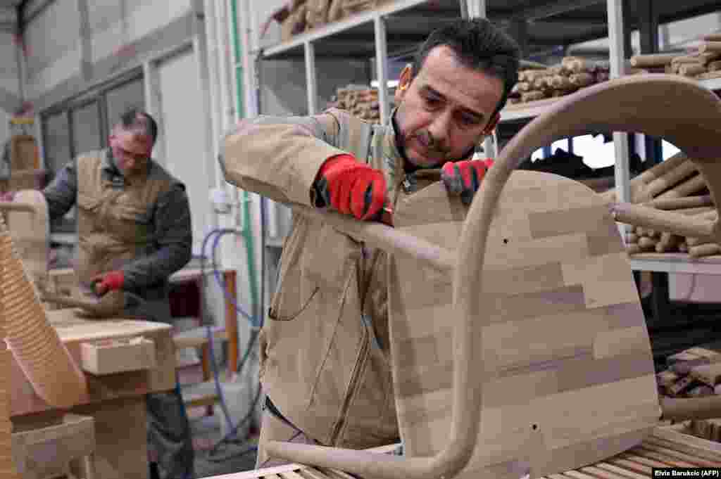 Workers sand chairs in the Artisan factory.&nbsp; Products from this factory are almost exclusively for the export market. Artisan-made seats similar to these sell for more than 1,300 euros each ($1,380) in Western European stores. The average salary in Bosnia is just 570 euros ($605) per month. &nbsp;