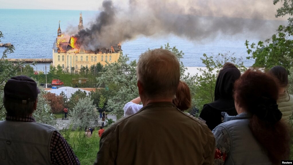 People look on as the local landmark burns after a Russian missile strike in Odesa on April 29. 