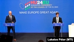 Hungarian government spokesman Zoltan Kovacs (left) and Janos Boka, minister for EU affairs, speak in Budapest on June 18, setting out the country's agenda for the six-month EU presidency.
