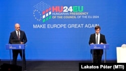 Hungarian government spokesman Zoltan Kovacs (left) and Janos Boka, minister for EU affairs, speak in Budapest on June 18, setting out the country's agenda for the six-month EU presidency.