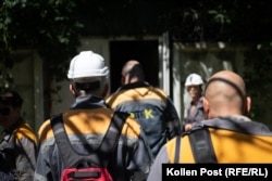 As another air-raid alarm sounds, DTEK employees file into an underground shelter.