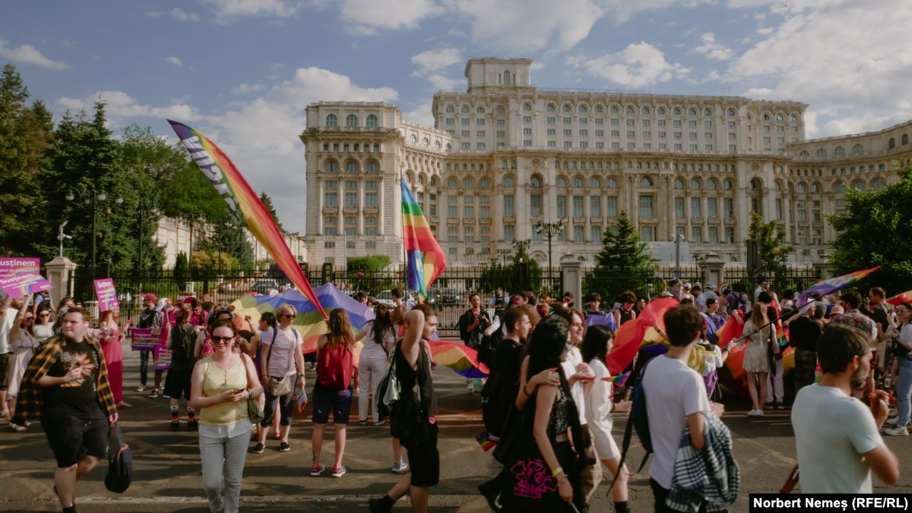 Participants march in front of the Palace of Parliament. However, 68 percent of those polled by ACCEPT thought all families, including same-sex families, should have legal protections.