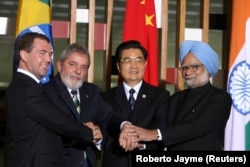 Former Russian President Dmitry Medvedev (left), Lula (second left), former Chinese leader Hu Jintao (second right), and India's former Prime Minister Manmohan Singh pose in Brasilia at a BRICS summit in 2010.