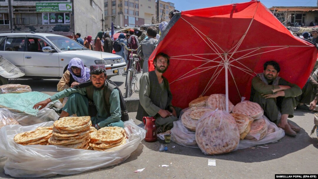 Afghan vendors sell bread on a roadside in Kabul.