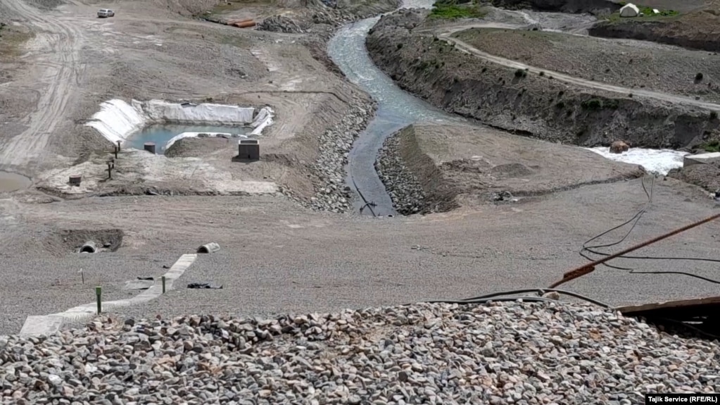 The beginning of the Romit River where a basin was created for the Pokrud gold mine that sends discharge from the mine into the river.