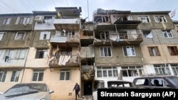 A damaged residential apartment building following shelling is seen in Stepanakert in the breakaway territory of Nagorno-Karabakh in Azerbaijan on September 19.