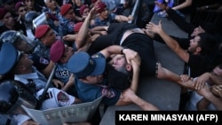 Armenia - Anti-government activists clash with Armenian police officers during a protest in Yerevan on June 12, 2024.