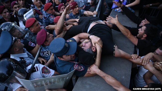 Armenia - Anti-government activists clash with Armenian police officers during a protest in Yerevan on June 12, 2024.