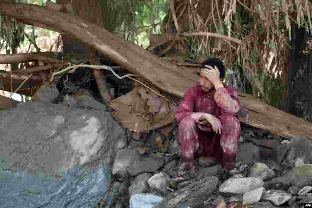 An Afghan man sits near his house that was damaged in the floods, which also affected&nbsp;Kabul and other regions.&nbsp; &nbsp;