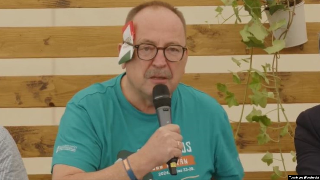 Hungarian Fidesz lawmaker Zsolt Nemeth with a folded paper "bandage" over his ear at the Tusvanyos Festival in eastern Transylvania on July 24.