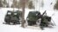 The heavy mortar mounted inside a trailer for the Finnish-made “piglet” tracked vehicle allows a firing crew to lob a dozen mortar rounds in a minute, then escape into the wilderness before an adversary's battery radars can pinpoint their location.