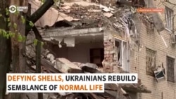 Defying Shells, Ukrainians Rebuild Semblance Of Normal Life