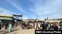 People wait to cross the Torkham border crossing between Afghanistan and Pakistan on February 24. 