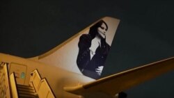 عکس مهسا امینی بر هواپیمای تیم فوتبال زنان برزیل