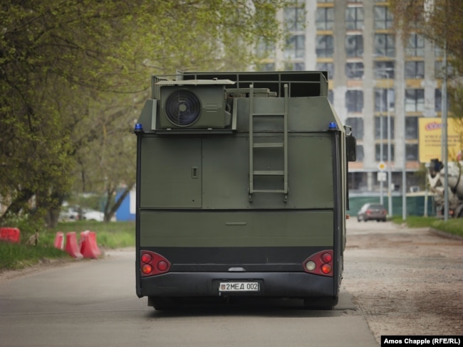 Air conditioning units and stairs to the back of the armoured vehicle.