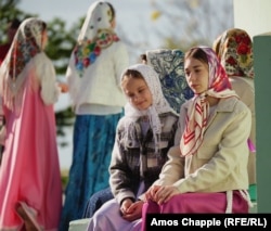 Lipovan girls sit outside church on Easter Sunday in Sarichioi.