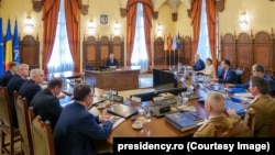 Ședință a Consiliului Suprem de Apărare a Țării (CSAT) condusă de președintele Klaus Iohannis (centru) la Palatul Cotroceni, pe 21 februarie 2024.