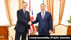 British Foreign Secretary David Cameron (left) and his Kazakh, counterpart, Murat Nurtileu meet in Astana on April 24