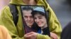 A demonstrator holds a picture of Iranian-German Jamshid Sharmahd (left), who has been sentenced to death in Iran, with his daughter Gazelle Sharmahd, in Berlin on July 31.