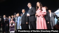 Chinese President Xi Jinping, Serbian leader Aleksandar Vucic, and their wives meet late on May 7.