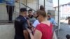 Обвиняемый военнослужащий-контрактник Арман Жуман и отец погибшей девочки Айдос Мелдехан у здания суда. Алматы, 26 июля 2023 года