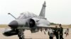 French pilots stand next to a Mirage-2000N fighter jet, June 23, 2007.