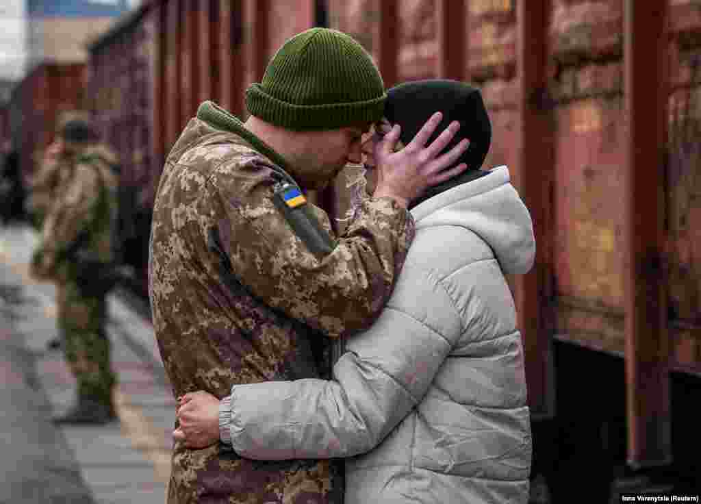 A Ukrainian soldier at a train station in Kramatorsk says goodbye to his wife who was visiting him during a short break from duty at the front.&nbsp;