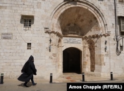 A priest walks into the Cathedral of St. James in Jerusalem's Armenian Quarter in June.