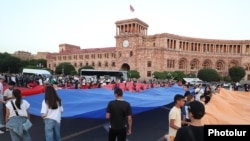 Young people celebrate Armenia's Constitution Day outside the main government building in Yerevan on July 5.