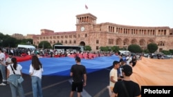 Young people celebrate Armenia’s Constitution Day outside the main government building in Yerevan on July 5, 2024.