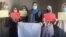 Afghan women stage a protest for women's rights to mark International Women's Day in Afghanistan.