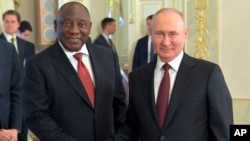 South African President Cyril Ramaphosa (left) meets with Russian President Vladiimir Putin in St. Petersburg on June 17.
