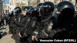 Riot police stand guard during an anti-government protest organized by the Shor Party in Chisinau on March 12.