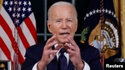 U.S. President Joe Biden delivers a prime-time address to the nation from the Oval Office of the White House in Washington on October 19.