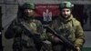 Українські військовослужбовці позують для фото в укритті на Донеччині, 21 лютого 2023 року