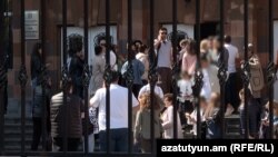 Parents rushed to take their children out of schools in Yerevan on Friday morning after a shooting spree threat disseminated online