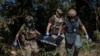 Ukrainian volunteers recover the body of a dead Russian soldier in the village of Blahodatne in southeastern Ukraine on September 8.<br />
<br />
Three months after the battle to liberate the village, the area has been deemed safe enough for volunteers to start the gruesome task of recovering the bodies. The route in to the village was nicknamed the &quot;road of death&quot; due to the number of Russian soldiers killed.<br />
<br />
<br />
<br />
&nbsp;