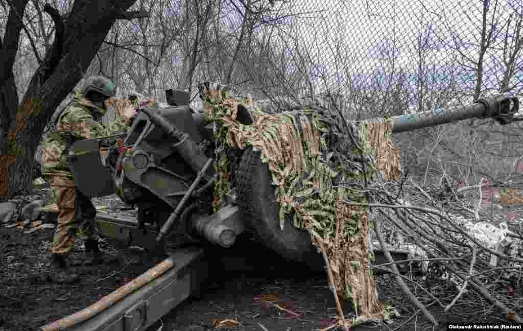 A Ukrainian soldier prepares to fire a howitzer from behind a screen of chain-link fencing near Bakhmut in March 2023. In the spring of 2022 videos began emerging showing Lancets, a kind of Russian-made suicide drone, destroying numerous pieces of valuable Ukrainian weaponry. &nbsp;