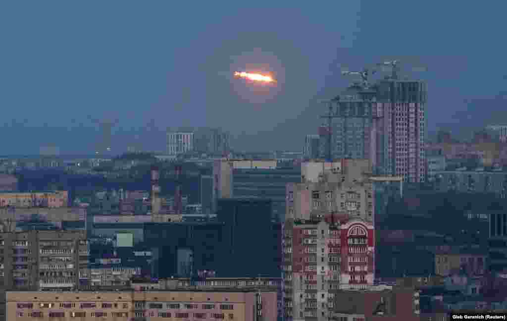An explosion from a missile is seen above the city of Kyiv. Ukraine&#39;s prosecutor general said the latest wave of Russian strikes had killed at least 16 people and injured almost 100.&nbsp;&nbsp; &nbsp;