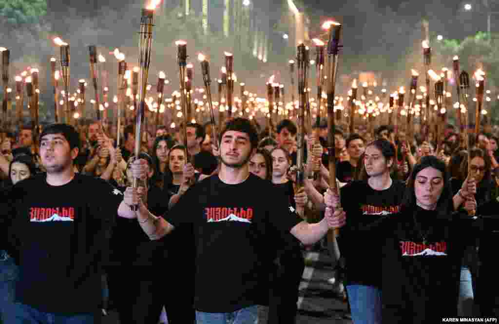 Torch-carrying participants march through the streets of Yerevan. On April 24, 2021, U.S. President Joe Biden officially recognized the mass killings as genocide. It was a move that had also been promised by President Barack Obama but failed to materialize.