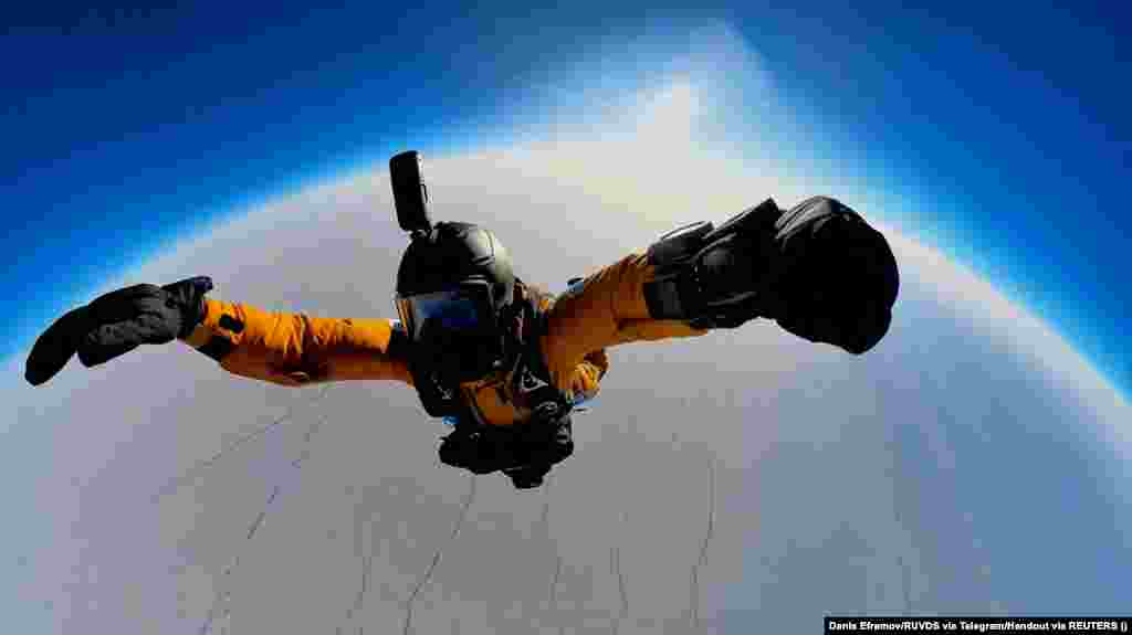 Denis Yefremov, a space technology engineer, performs a parachute jump from the Earth&#39;s stratosphere to an area near the Russian polar station Barneo, close to the North Pole, on April 12.