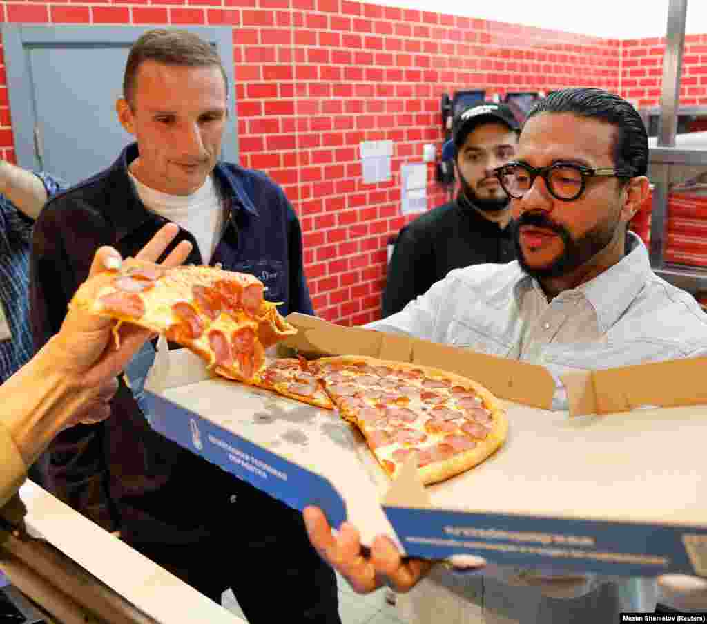 Russian restauranteur Anton Pinsky (left) and pro-Kremlin rapper Timati took over the assets of Domino&#39;s Pizza following the brand&#39;s exit from the country.&nbsp; It is not the first Russian outlet of a multinational company to be &quot;rebranded&quot; by the pair.&nbsp; &nbsp;