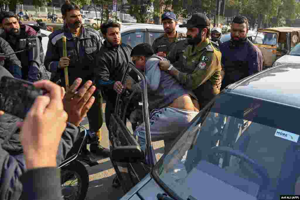 Pakistani police in Lahore detain supporters of former Prime Minister Imran Khan&#39;s Pakistan Tehrik-e-Insaf party as they protest against alleged skulduggery in the South Asian country&#39;s national elections.
