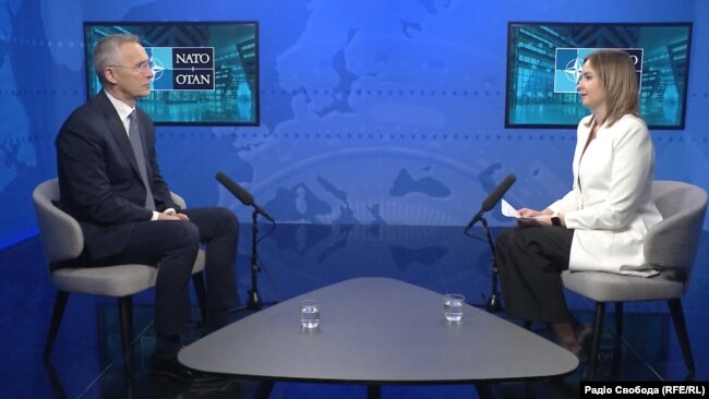 NATO Secretary-General Jens Stoltenberg (left) speaks with RFE/RL in Brussels on April 3.