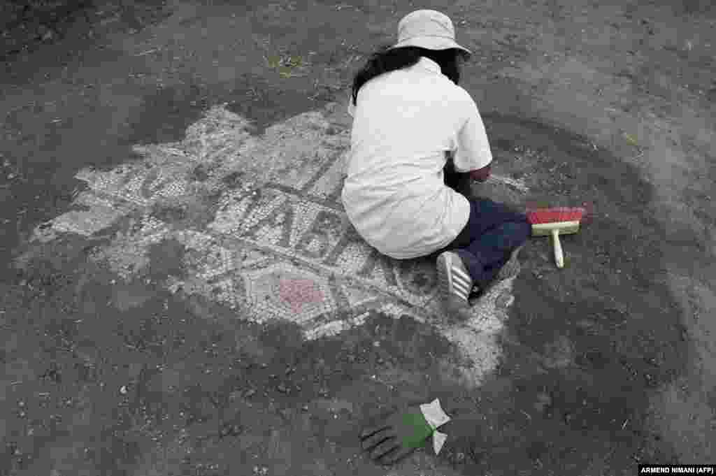 Another file photo from 2014 shows an archaeology student unearthing a mosaic. &ldquo;Such discoveries offer a unique perspective on culture and human history and provide extensive knowledge about the ancient structures of the Ulpiana Archaeological Park,&quot; EU Ambassador to Kosovo Tomas Szunyog said.